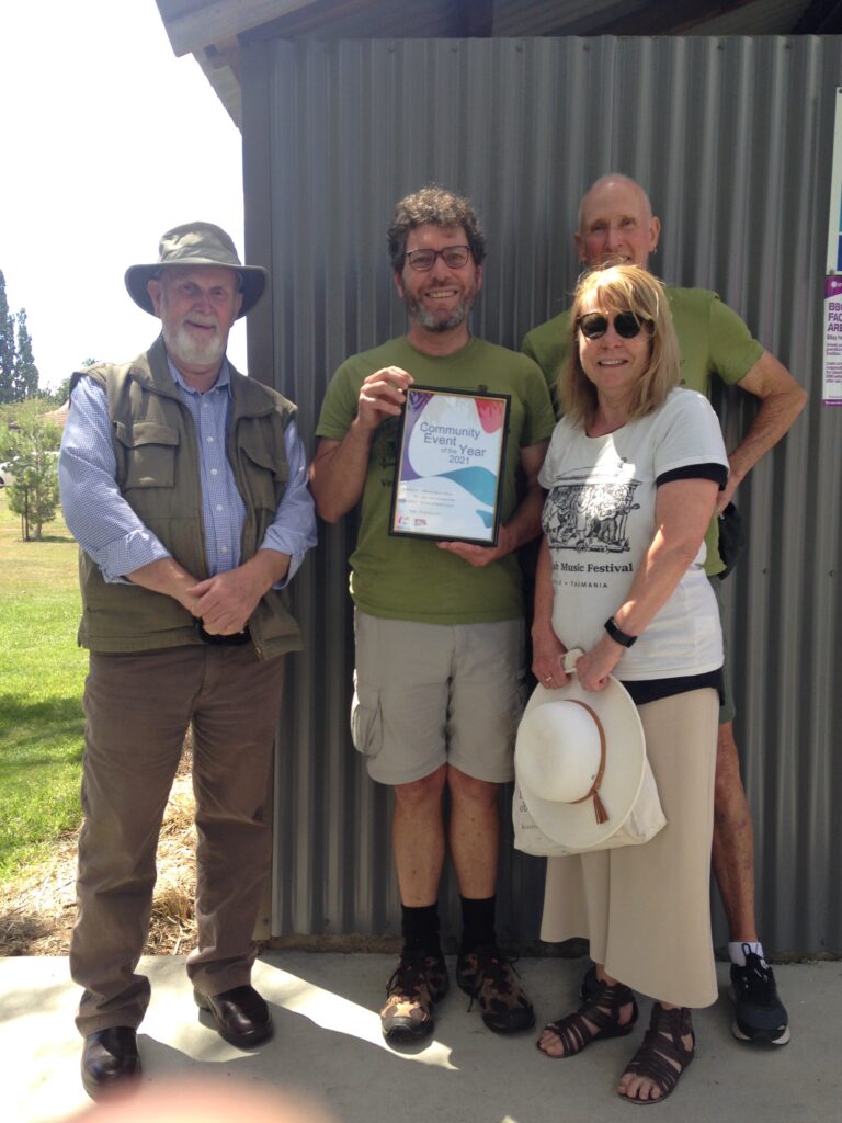 Verandah Music Festival Committee poses with a certificate for Community Event of the Year 2020 award.